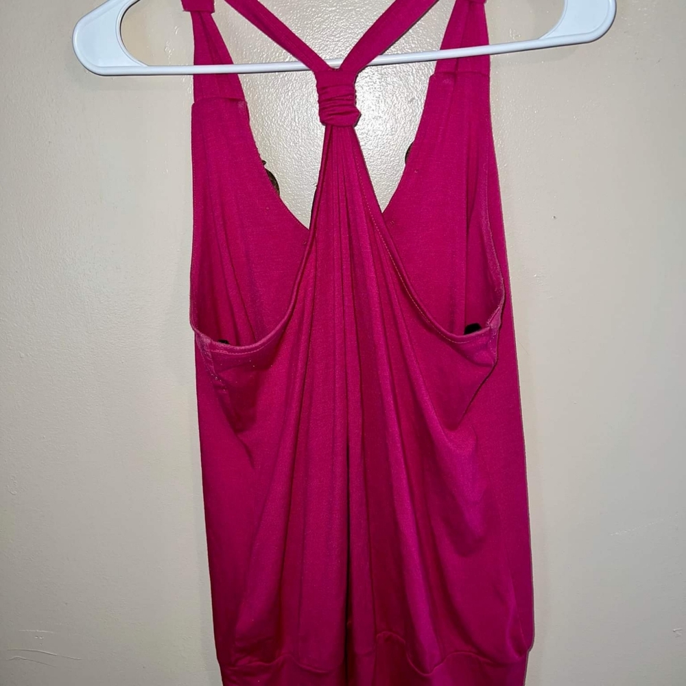 Boho meets Racerback Chic in this deep fuchsia top with light chunky wood bead